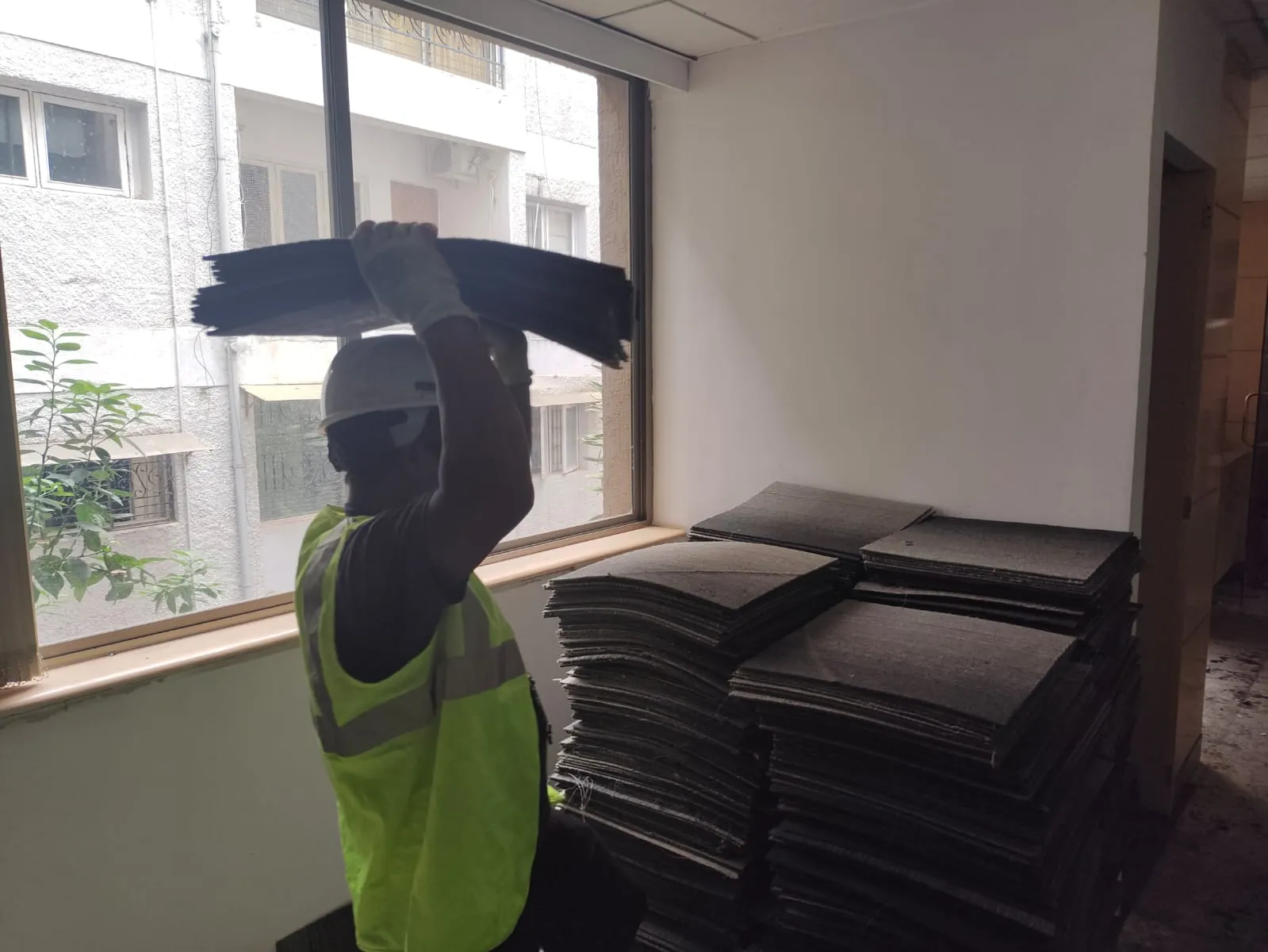 Professional technicians performing complete office dismantling services in HSR Layout inside a large commercial startup hub